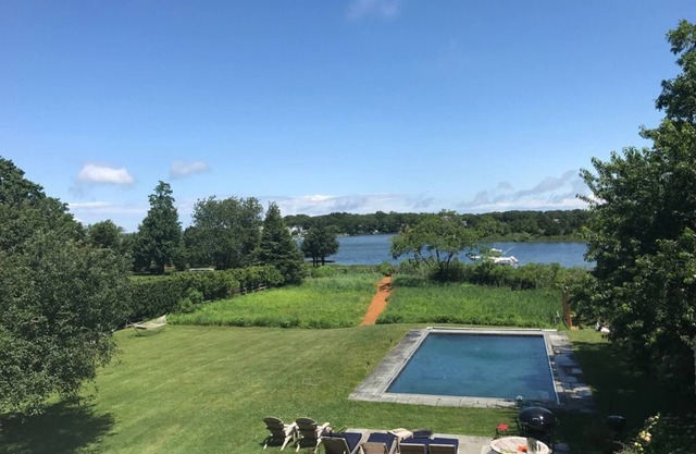 Stunning Waterfront Home with Pool, Boat Dock, and Acre of Land