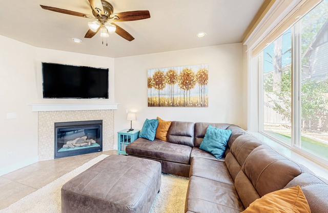 Stylish all-season home with dog-friendly yard, patio, central AC & washer/dryer