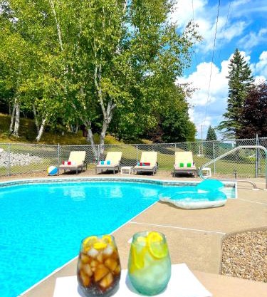 Stylish Mountain View Chalet with Heated Pool, Large Hot Tub, Playroom & Firepit close to Gore Mountain
