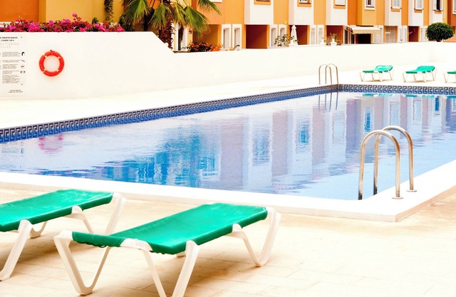 Sunset view and pool in Paradise Luxurious apartment with views and pool.