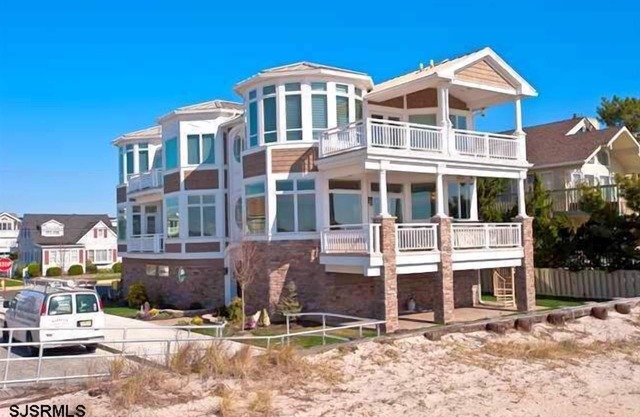 Super upscale, one of a kind designed beach front property just steps away from the beach
