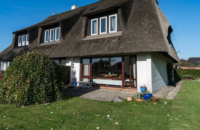 Surrounded by a large garden, the thatched roof house also impresses on the inside