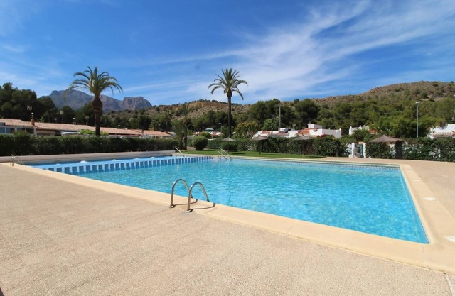 Terrace house with communal swimming pool
