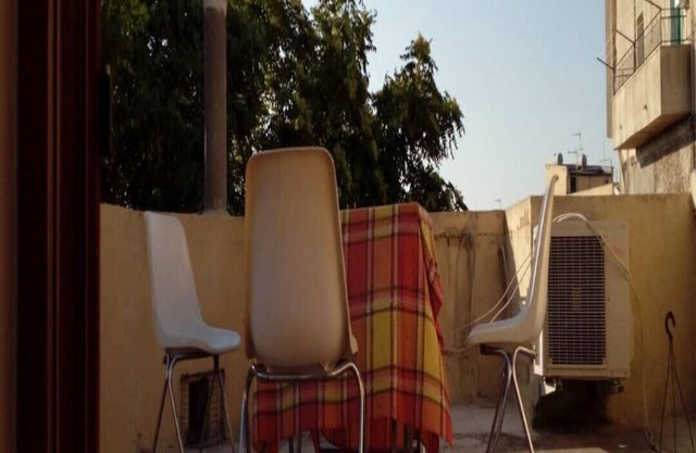 The house next to the leafy green