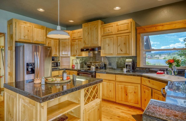The House on the Point: Lakefront Home with Private Dock, Fireplace, Mountain Views, and 2 Garages!