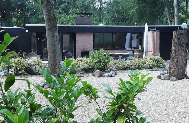 This beautifully situated vacation home is located in a wooded area in a welcoming vacation park nea