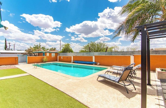 This centrally located 3 bedroom 2 bathroom features a full size pool and electric vehicle charging on site.