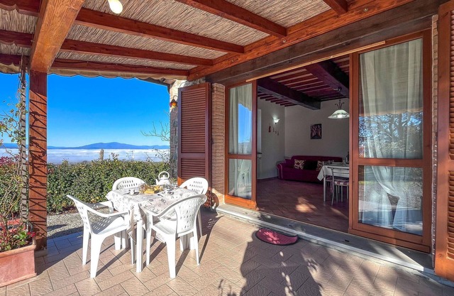 This pretty vacation home welcomes you with a sweeping view of the countryside.