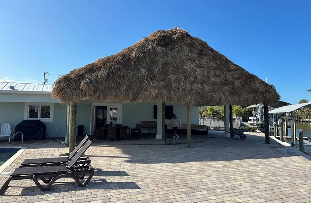 THREE MASTER SUITES-POOL -WATERFRONT ON CORNER LOT - BOAT LIFT -OUTDOOR KITCHEN