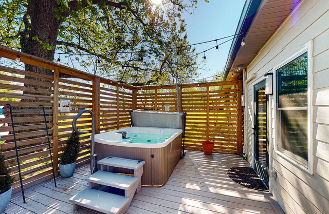 Tranquil home with private hot tub, sunroom, den, office & lovely backyard
