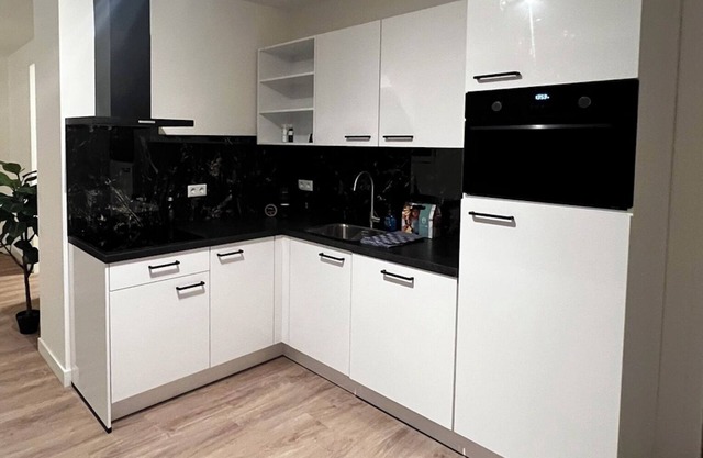 Trendy apartment with fast WiFi, parking, and contemporary décor near Goirle's center. Sleeps four.