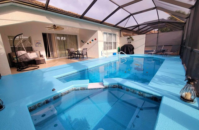 Twin Villa Pool home with spa in Colonial Country Club.