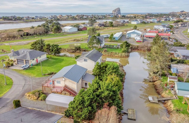 Updated Pacific City Home Boasts River Views, Game Room and Firepit!