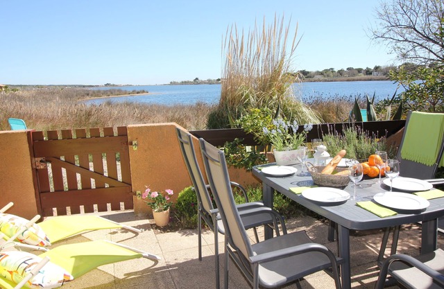 Vacation home directly on the beach in a dream location in a complex with a pool
