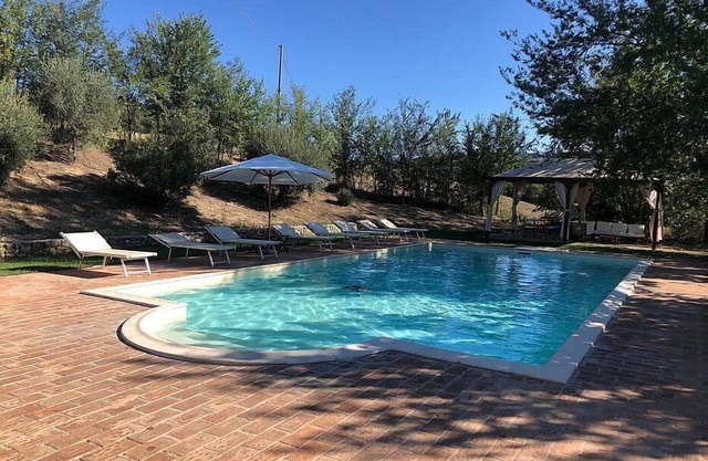 Villa Gramigna: A charming two-story villa surrounded by the greenery.