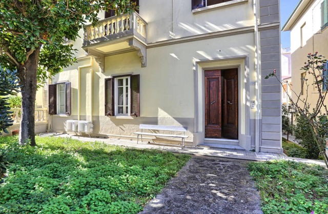 villa with parking space and private outdoor space