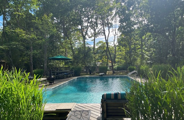 Wake up in the trees and walk to the beach! Chef's kitchen, pool, large decks!