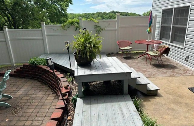 Walkout basement apartment with private patio supplied with a grill and fire pit