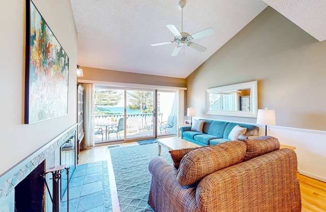 Waterfront condo near skiing with beach access, on-site golf & fireplace