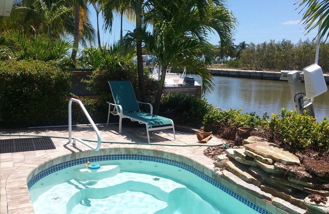 Waterfront, dock, easy ocean access, heated pool, walk to beach! Great location!