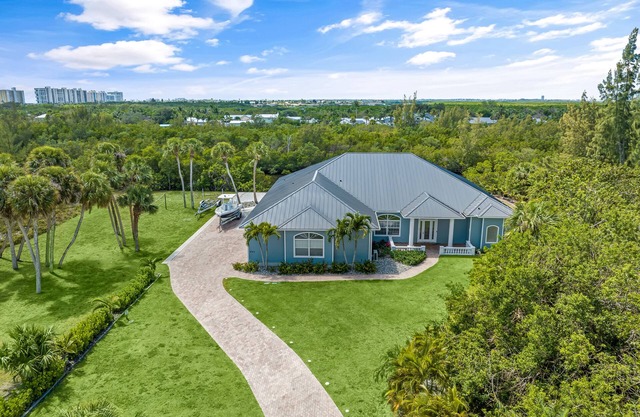 Waterfront home/steps to the beach/private dock/heated pool/spa