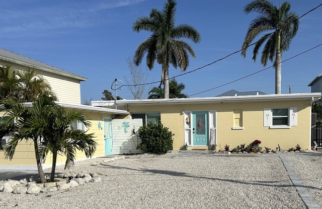WE ARE BACK! NEWER POOL/SPA and Walk to beach! Totally updated Canal front home!