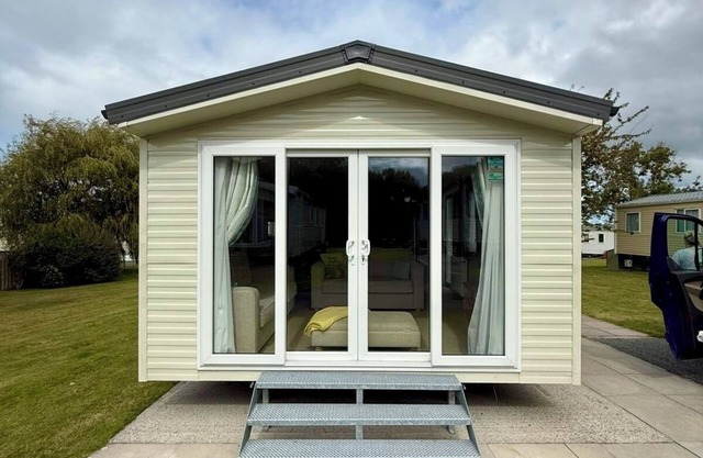 Welcoming family caravan on large pitch near beautiful New Quay in West Wales