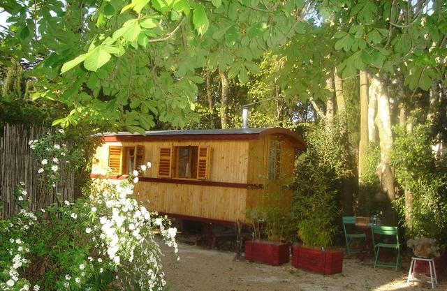 Wooden Bulgarian caravan in a wooded garden