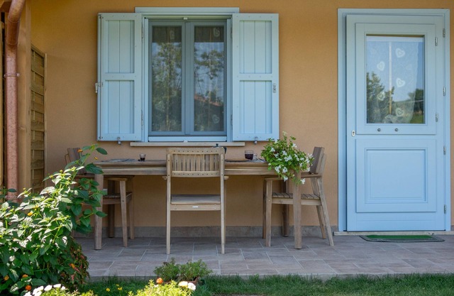 Wooden house with porch and garden
