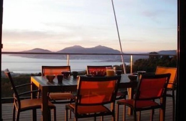 Wooden lodge on piles nestled in the scrubland,view over the Bay of Ajaccio