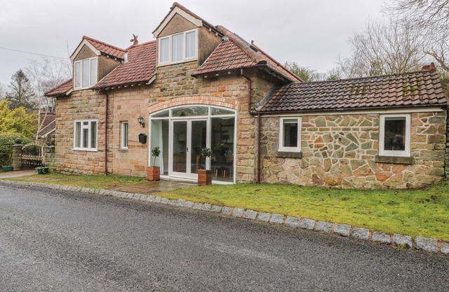 WYKE LODGE COTTAGE, pet friendly, with open fire in Staintondale
