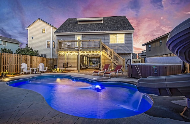 Your Ultimate Retreat – Steps from Beach with PVT Heated Pool, Slide & Hot Tub!