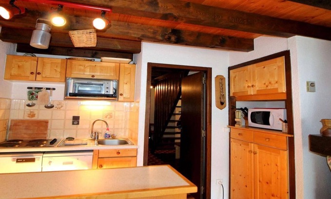 Champagny-en-Vanoise Apartment | 100m from ski slopes, 2nd floor, balcony, fireplace or stove, tv, ski locker, 55m²