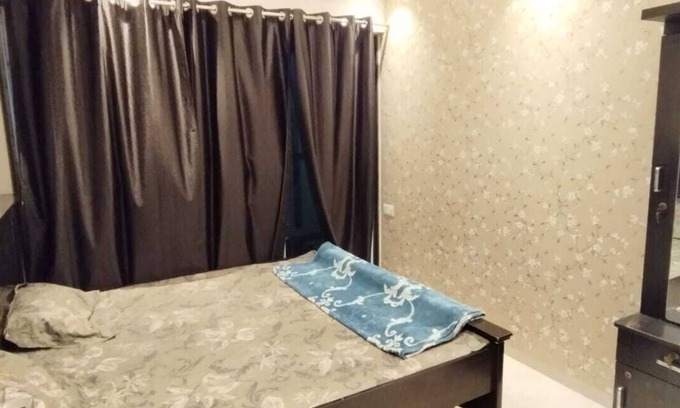 Kharghar Apartment | 1BHK flat fully furnished bedroom, hallway with single bed balconies.