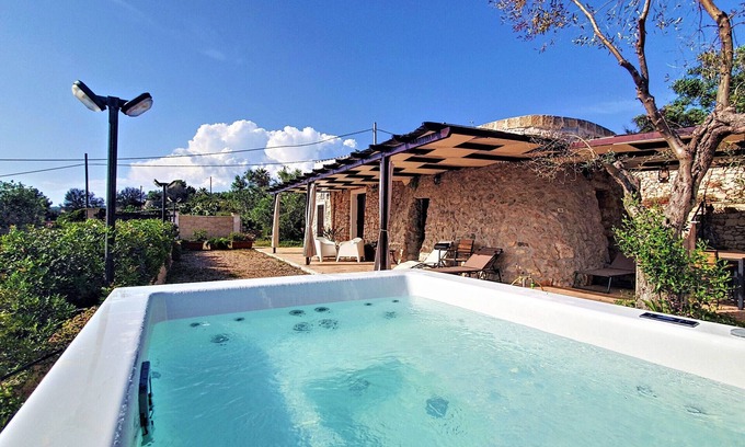 Marina di Felloniche Cottage | 250m from beach: renovated stone house w/jacuzzi
