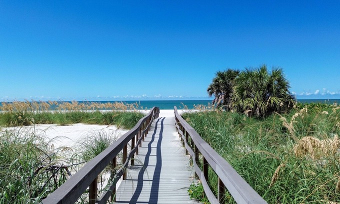 Treasure Island Apartment | 🌞400 ft to the Beach👙Onsite Heated Pool🐬Bungalows #8🌴Grills🐶Dogs Welcome!