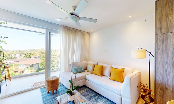 Jaco Apartment | 4th-floor condo with water view, on-site pool, private balcony, & W/D