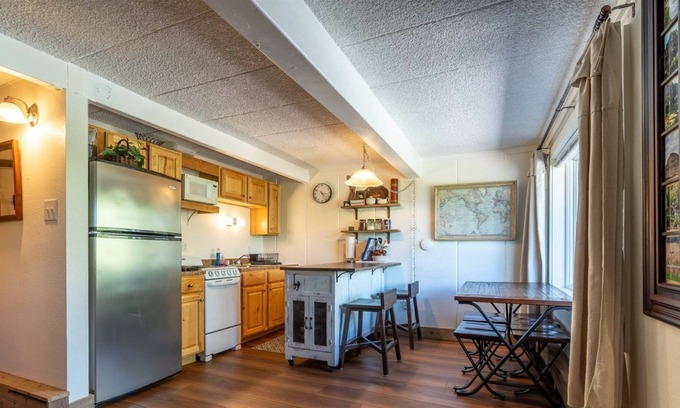 Glenwood Springs Condo | A bedroom alcove maximizes sleeping privacy in this condo.