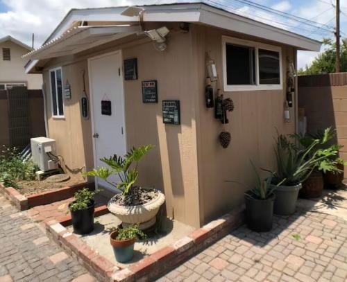Norwalk House | A small room in the backyard with a full bed
