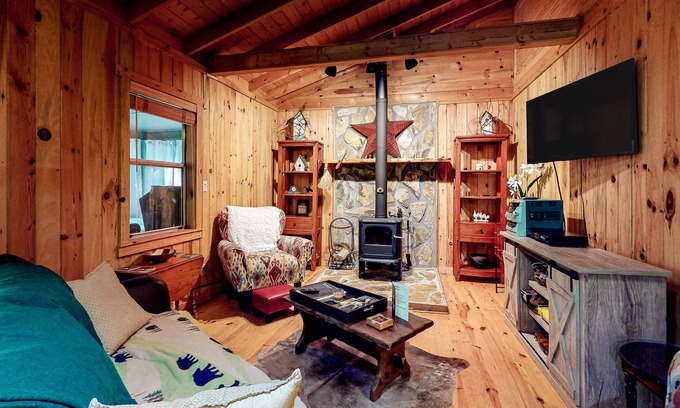 Cashes Valley Cabin | Adorable cabin w/ a private hot tub, screened porch, firepit, & forest views