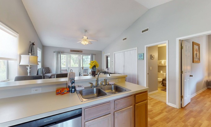 Surfside Beach Condo | Airy condo in a great location with balcony, W/D, and pool access - dog-friendly