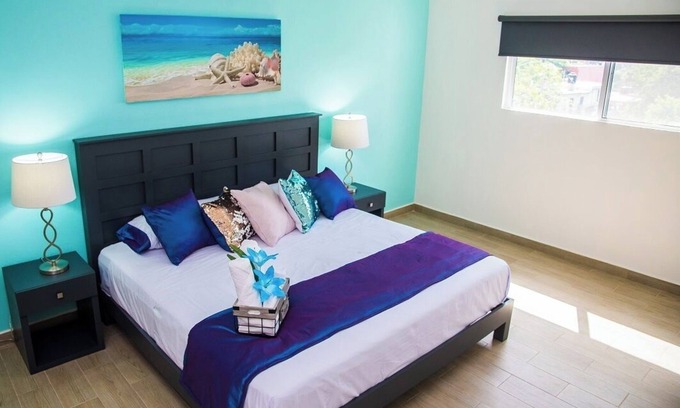 Luis Donaldo Colosio Condo | Amazing 2 BD 2 Bath | Rooftop patio & pool | Walk to beach | Family friendly