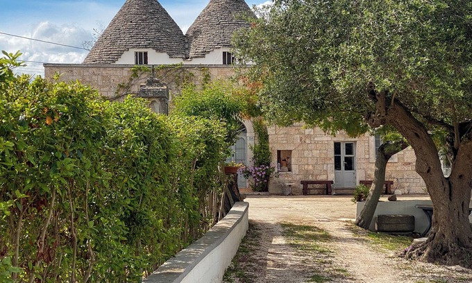 Valenzano House | Ancient Trullo surrounded by greenery in the heart of Valle D'Itria