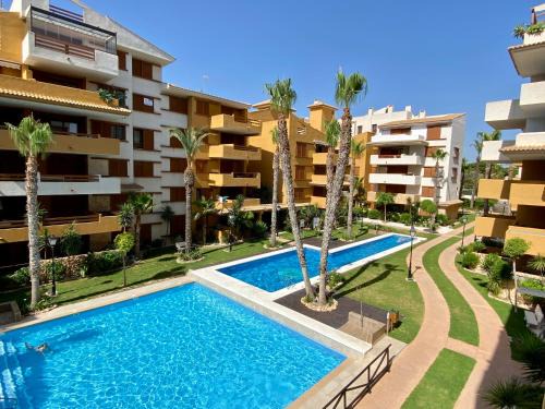 Punta Prima Apartment | Apartamento con piscina y playa cercana en Torrevieja, area de Punta Prima AQ-125
