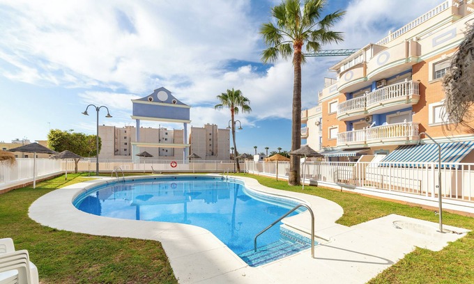 Roquetas de Mar Apartment | Apartment 'Esbamar Vi' with Shared Pool, Wi-Fi and Air Conditioning
