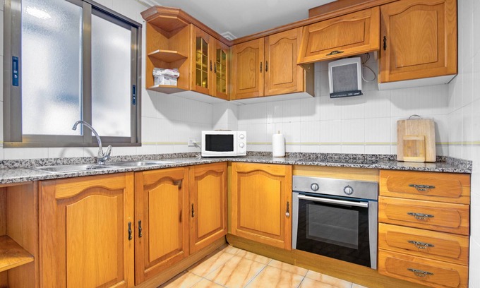 Grao de Gandia Apartment | Apartment 'Playamar I' with Shared Pool, Shared Garden and Air Conditioning