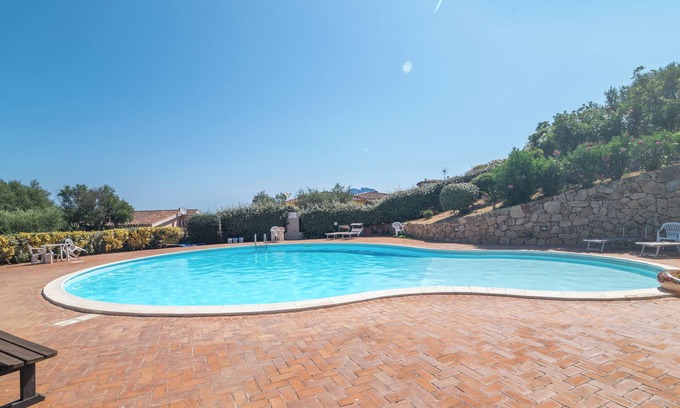Porto San Paolo Apartment | Apartment 'Tavolara Porto San Paolo E2' with Sea View, Shared Pool and Air Conditioning