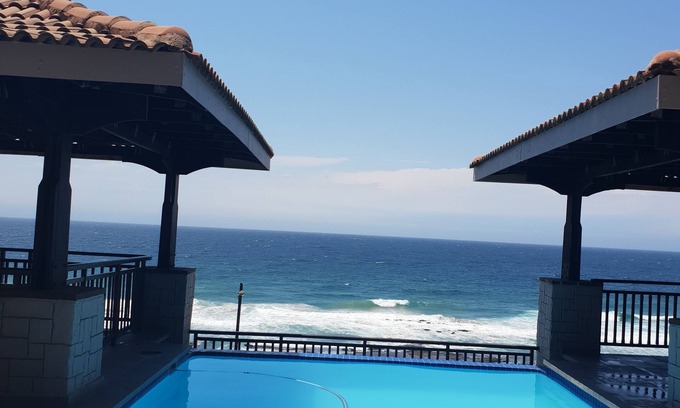 Umhlali Apartment | Bali Hai Beach and Sea Views. Beachfront infinity pool overlooking the ocean.