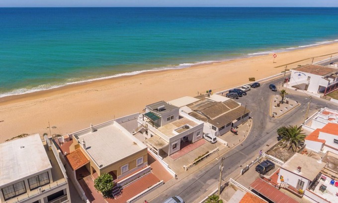 Faro House | Beach front right on the Sand Luxury semi-detached 3-bed house on the beach.