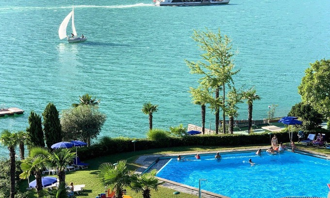 Bissone Apartment | Beautiful apartment for 4 people with A/C, WIFI, pool, TV, balcony and panoramic view